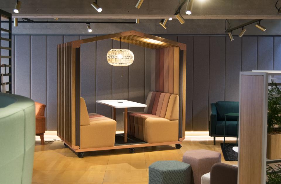 Modern soft seating pod by sixteen3, featuring cozy booths and a stylish pendant light, designed for collaborative workspaces.