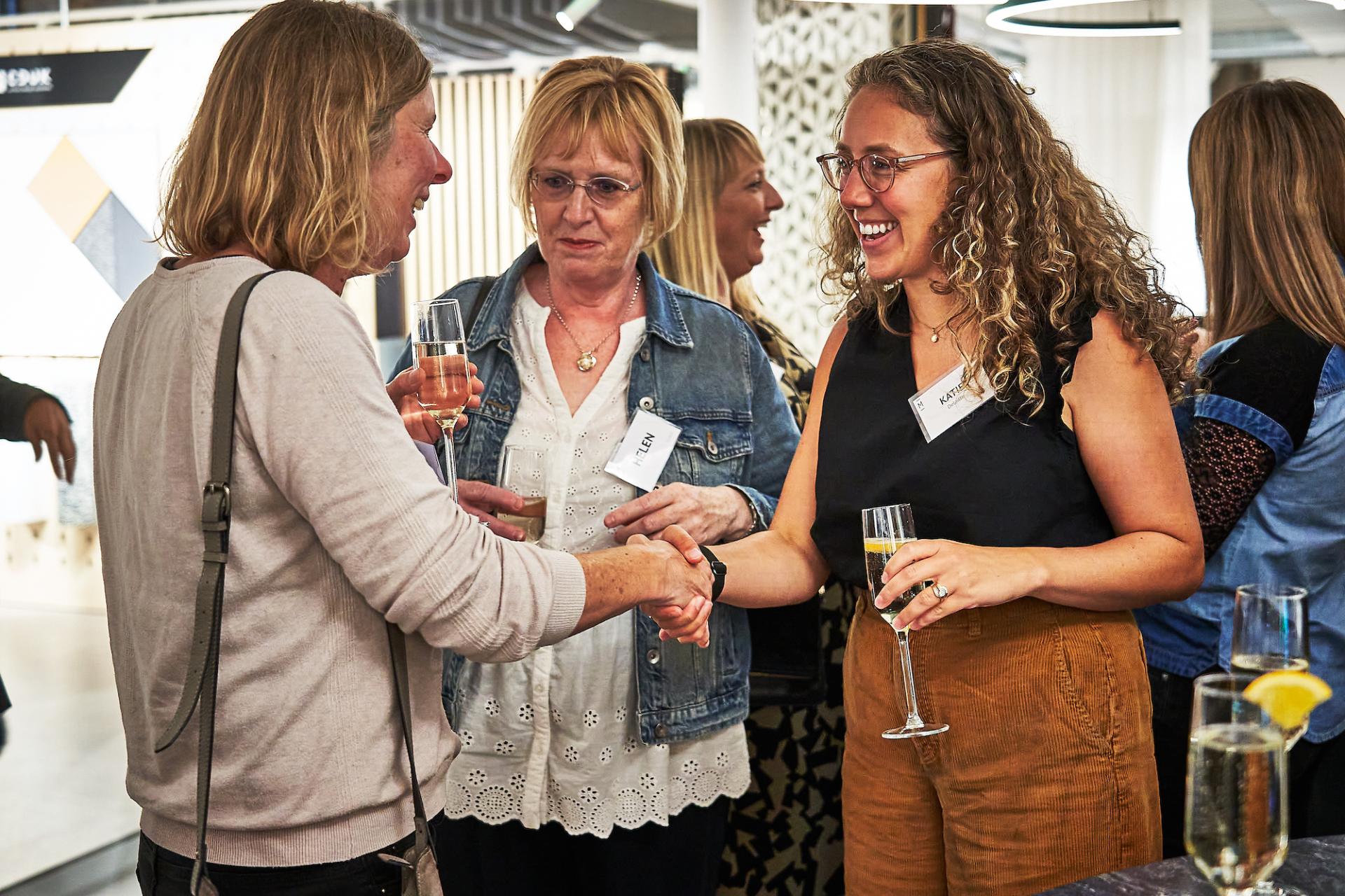 Women celebrating and networking at the 42 Gathering event for the podcast 42 Roles in the Built Environment.