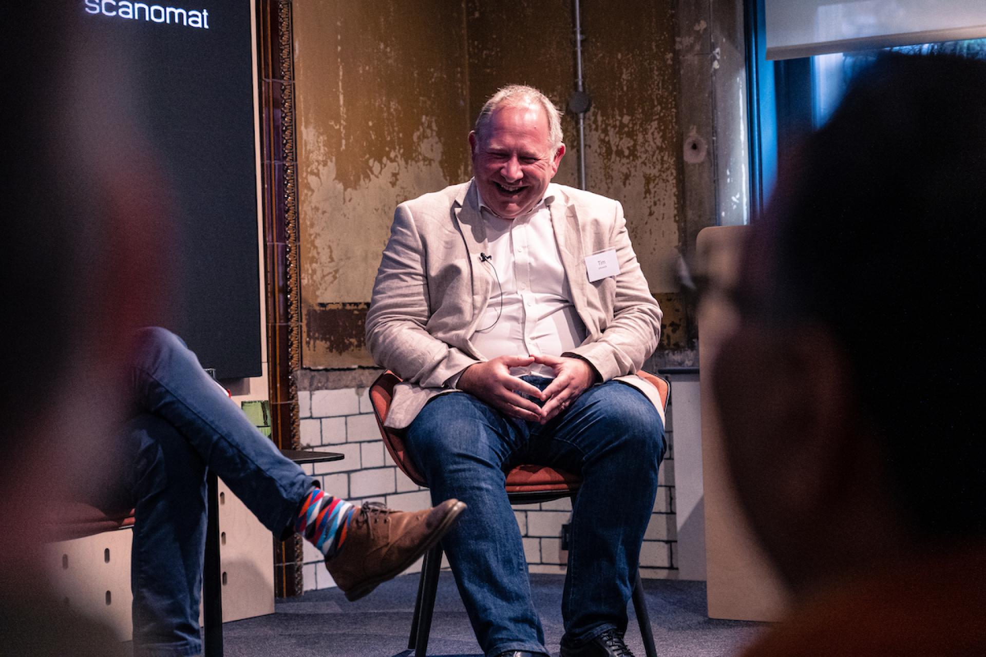 Seminar speaker enjoying a moment during the Manchester Property Outlook discussion at Material Source Studio.