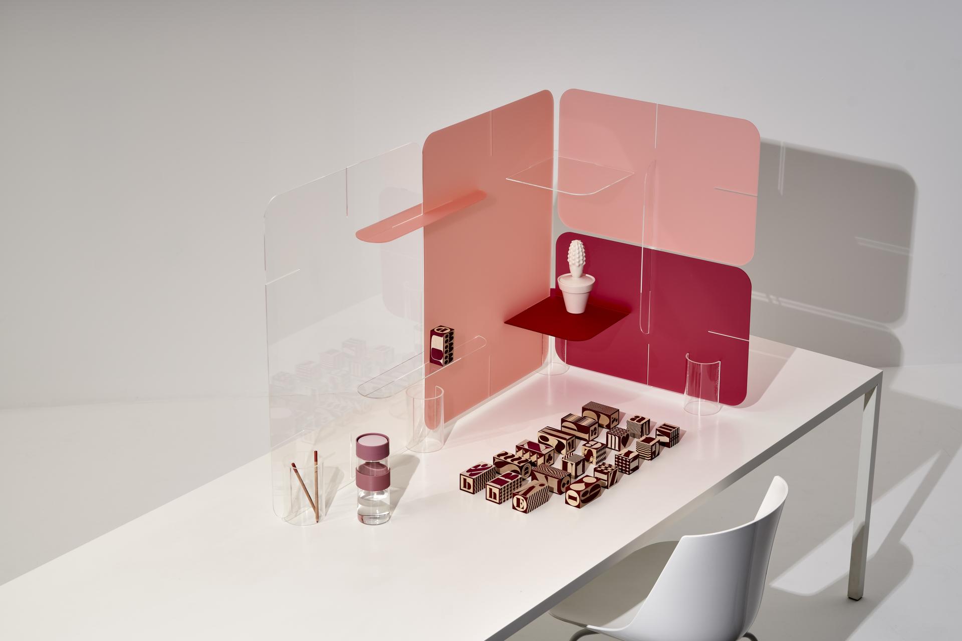 Innovative workspace design featuring transparent panels and vibrant accents, highlighting Zahava Elenberg's Clikclax solution for collaboration.