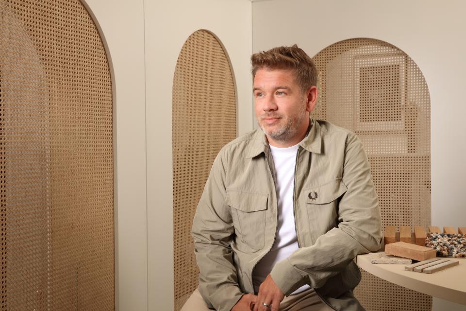 Simon Millington, founder of Incognito, poses thoughtfully in a stylish interior design setting, highlighting his innovative approach.