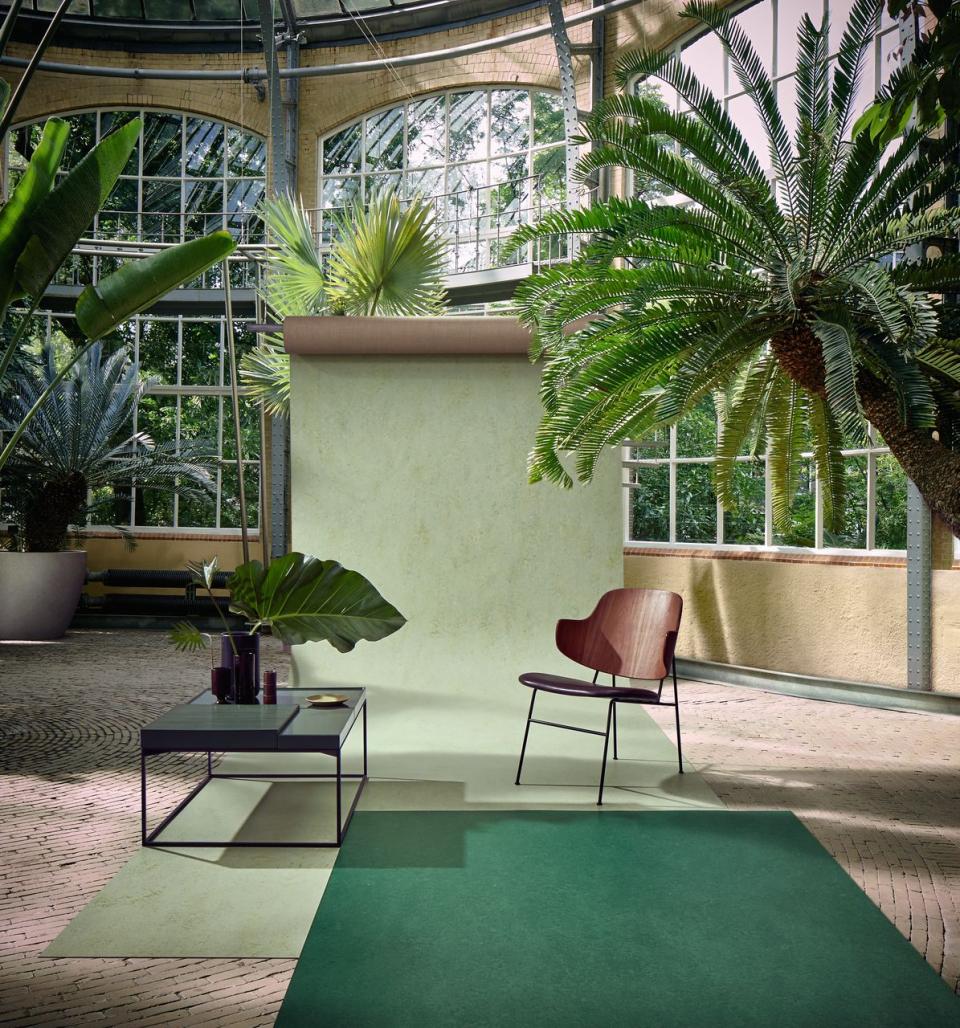 Forbo's Marmoleum Marbled collection showcased in a vibrant natural setting with plants and stylish, sustainable decor.
