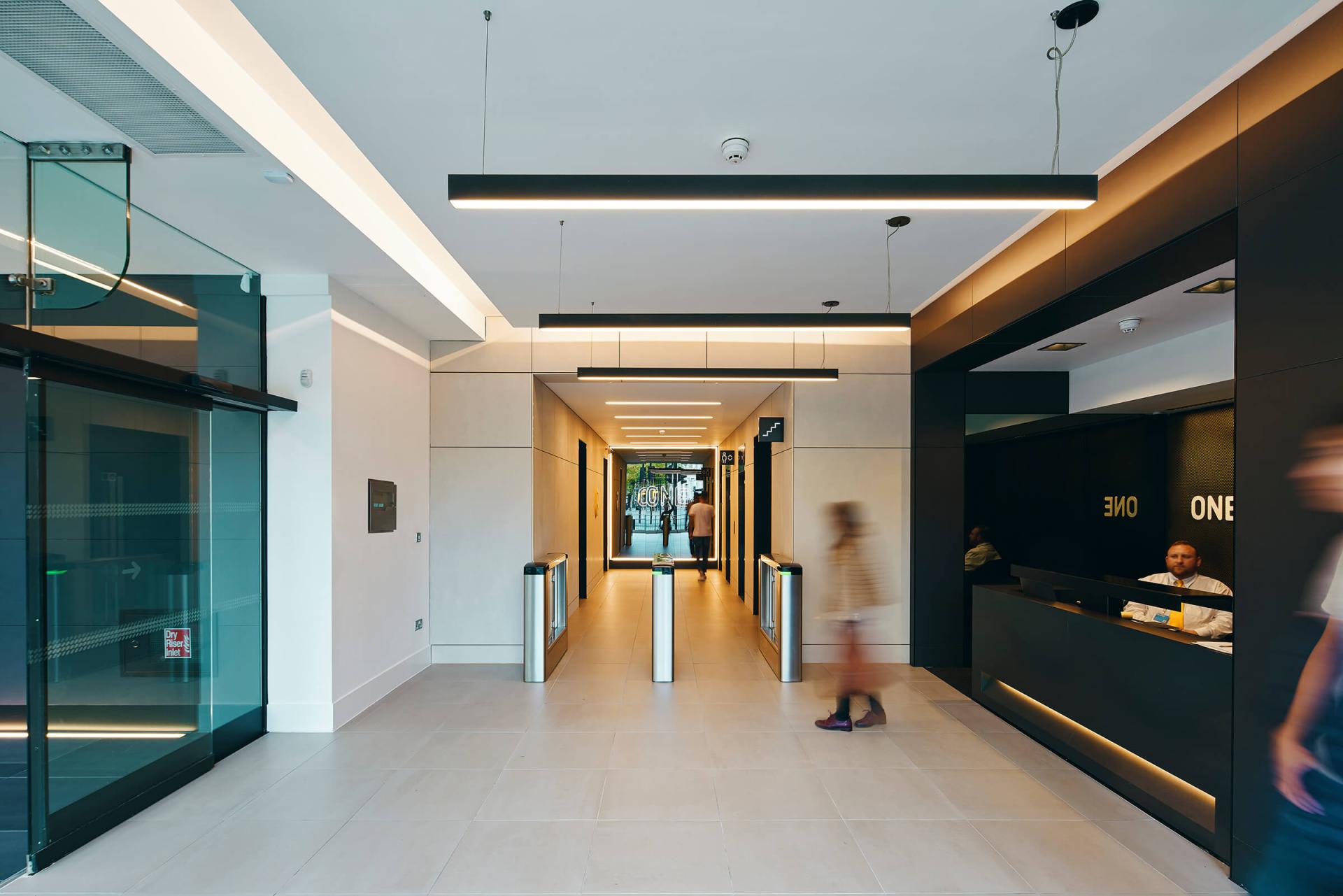 Modern office lobby with sleek design and reception area, reflecting Jasper Sanders' innovative approach to commercial spaces.