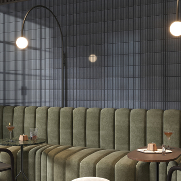 Stylish interior featuring Kakam 2.0 porcelain mosaic tiles, plush seating, and elegant lighting, inspired by Japanese design aesthetics.