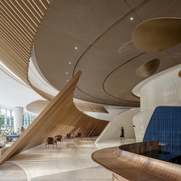 Innovative interior design of The Florescence in Guangzhou features sweeping curves and elegant floral-inspired elements.