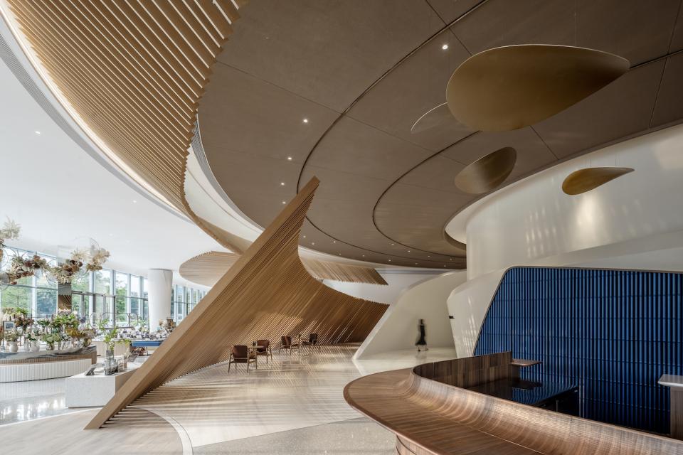 Innovative interior design of The Florescence in Guangzhou features sweeping curves and elegant floral-inspired elements.