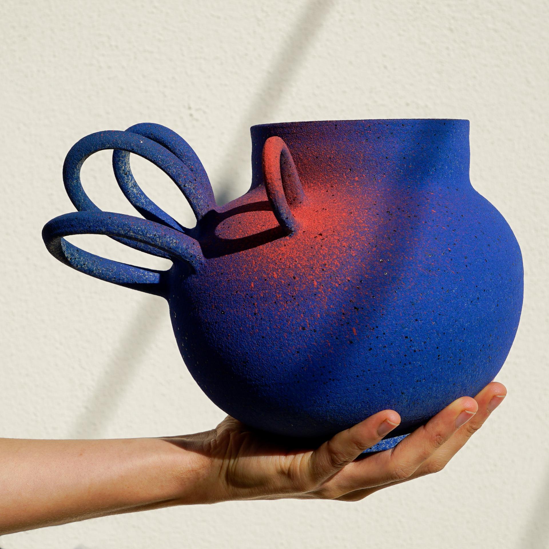 Colorful blue ceramic vase with unique handles, showcased at the Future Icons Selects exhibition during London Craft Week 2023.