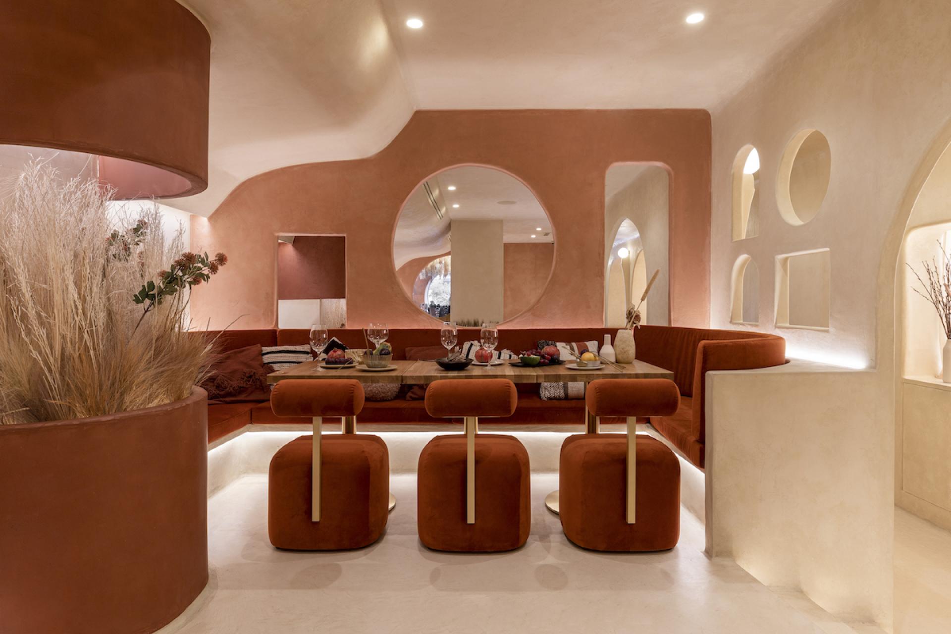 Stylish restaurant interior of Living Bakkali in Valencia, featuring Middle Eastern-inspired design elements and cozy seating.