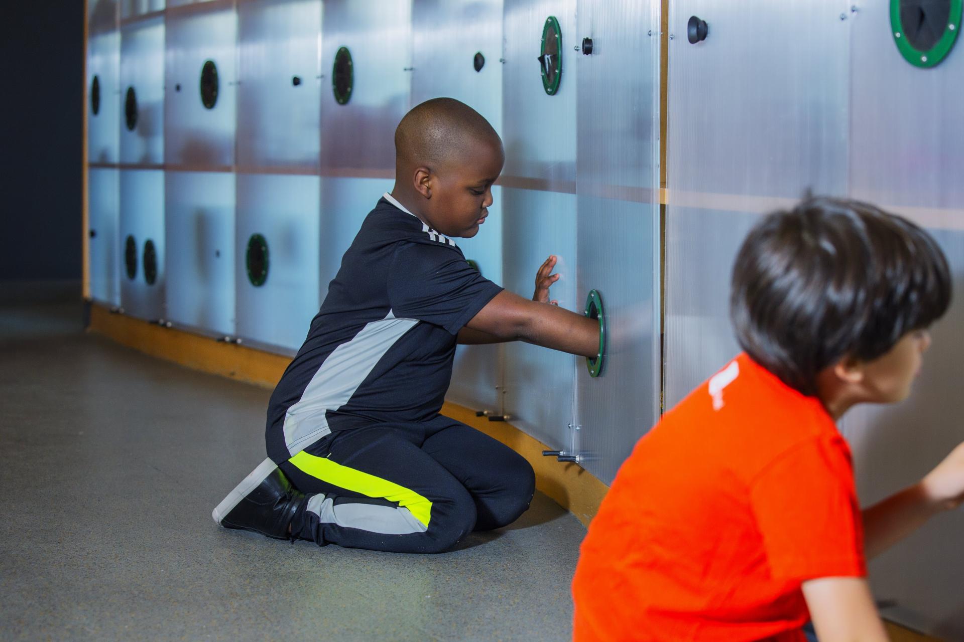 Children engage with interactive art features in the ColorLab, a creative space designed for young artists in Brooklyn.