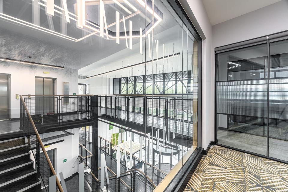 Modern coworking space interior at The Bee House, featuring open layouts and stylish design elements for flexible work.