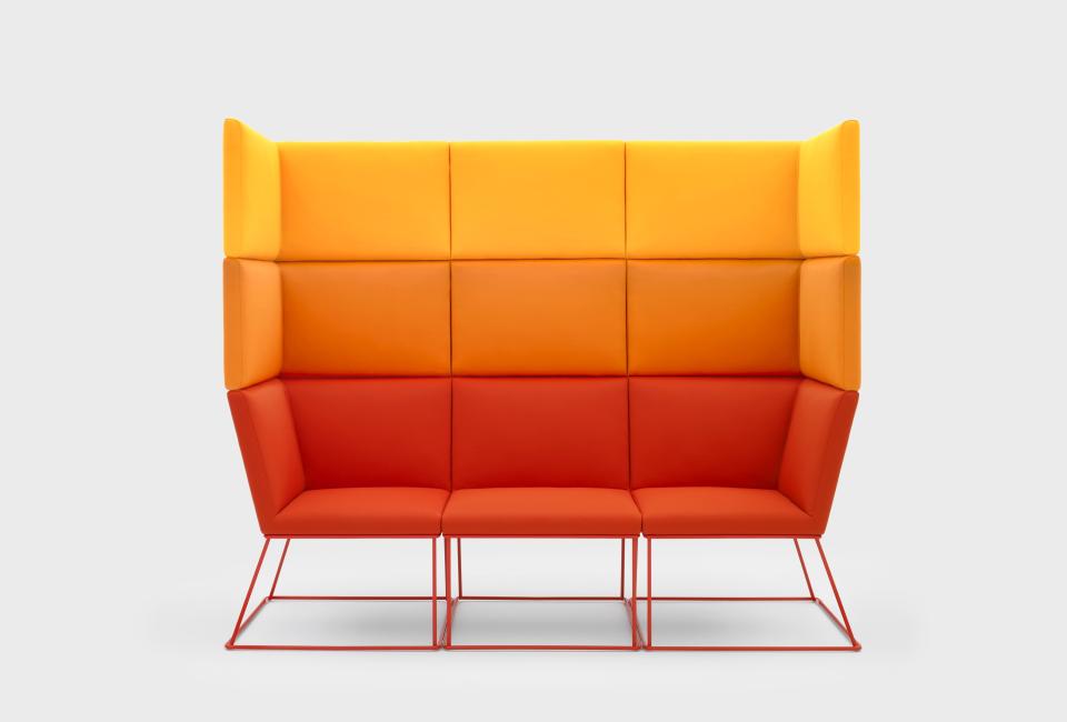 Vibrant modern sofa in orange and yellow hues, showcasing VIGANÒ & C.'s innovative furniture design and style.