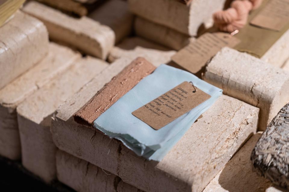 Textiles and biomaterials displayed at the From The Ground Up exhibition, highlighting innovative, sustainable design practices.