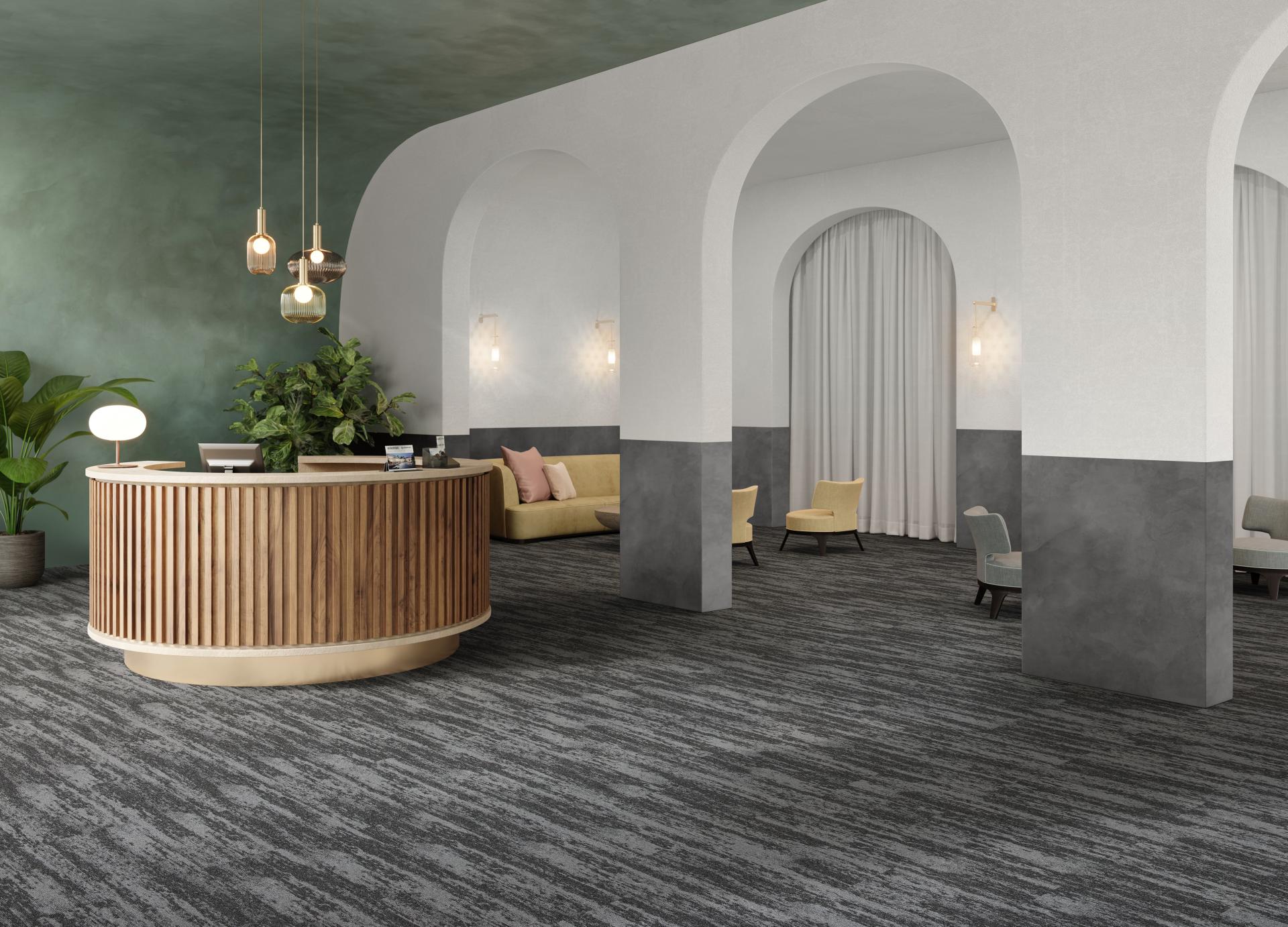 Modern reception area featuring Rudiments carpet tiles, elegant furnishings, and stylish decor in a contemporary setting.