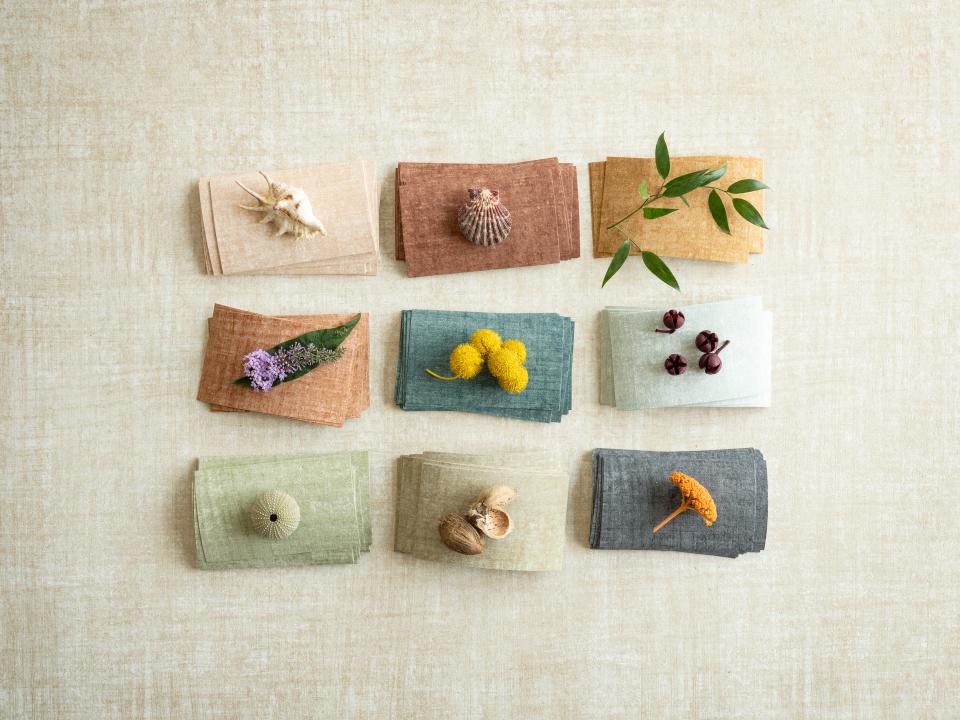 Autumnal fabric swatches in earthy tones with natural elements, showcasing Arte's Brushed Suede and Washed Linen collections.