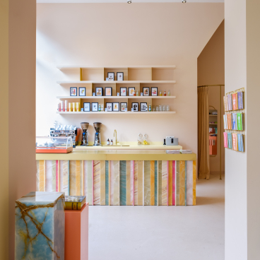 Colorful Onyx bar and fixtures create a vibrant atmosphere in the stylish office and coffee shop designed by SolidNature and Anne Claus.