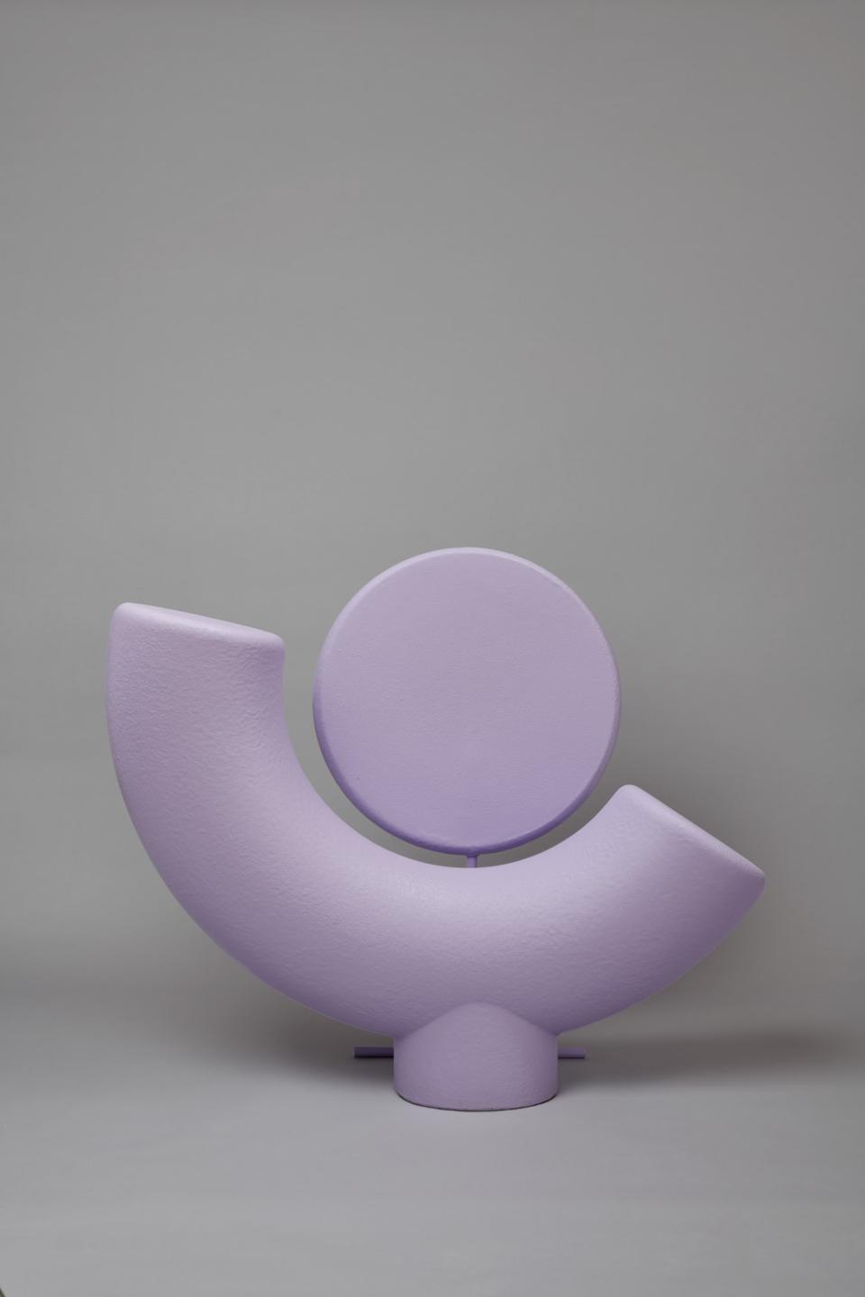 A whimsical modern chair in soft lavender, symbolizing friendship, part of Mas Creations by Masquespacio's collection.