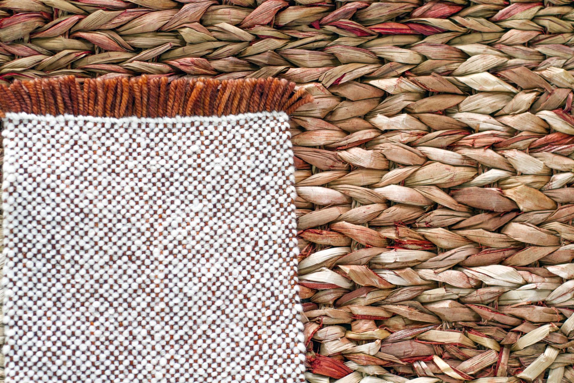 Close-up of woven bullrush sedge and wool fabric detailing from Carolina Palombo's Tutura chair design.