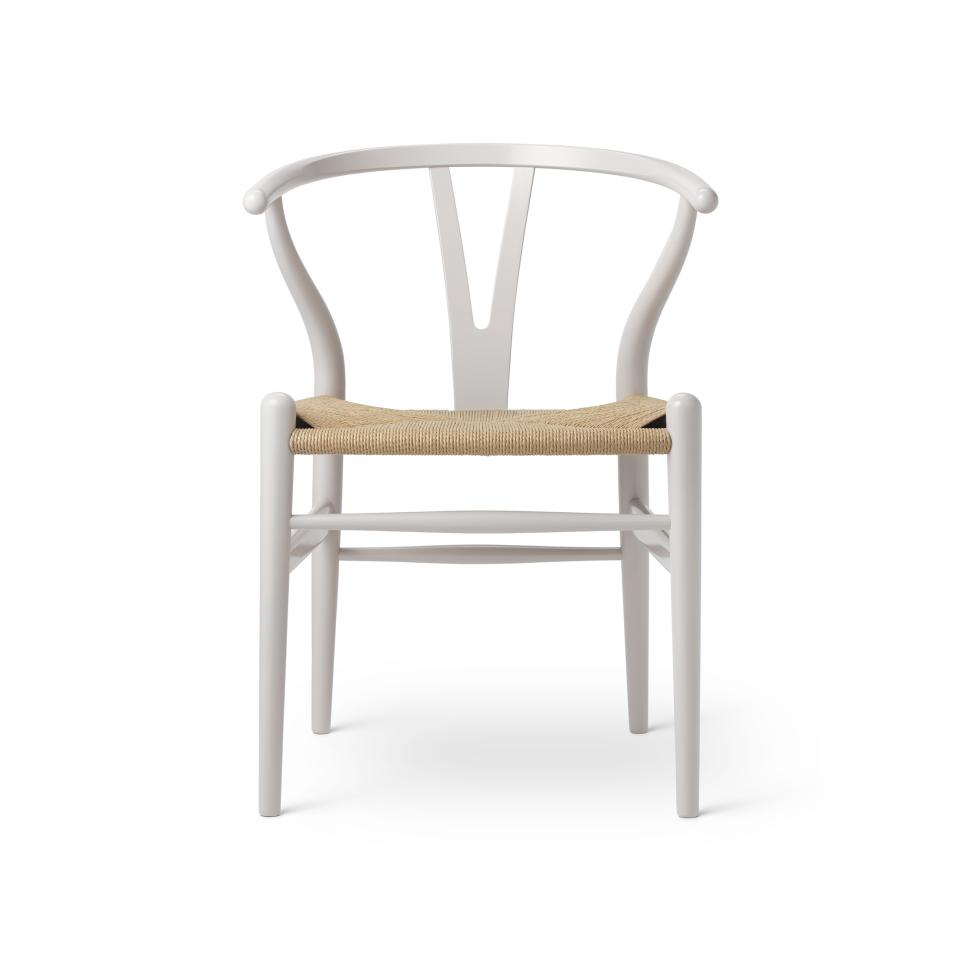 Wishbone chair by Carl Hansen & Son, featuring a minimalist design with a woven seat in nature-inspired colors.
