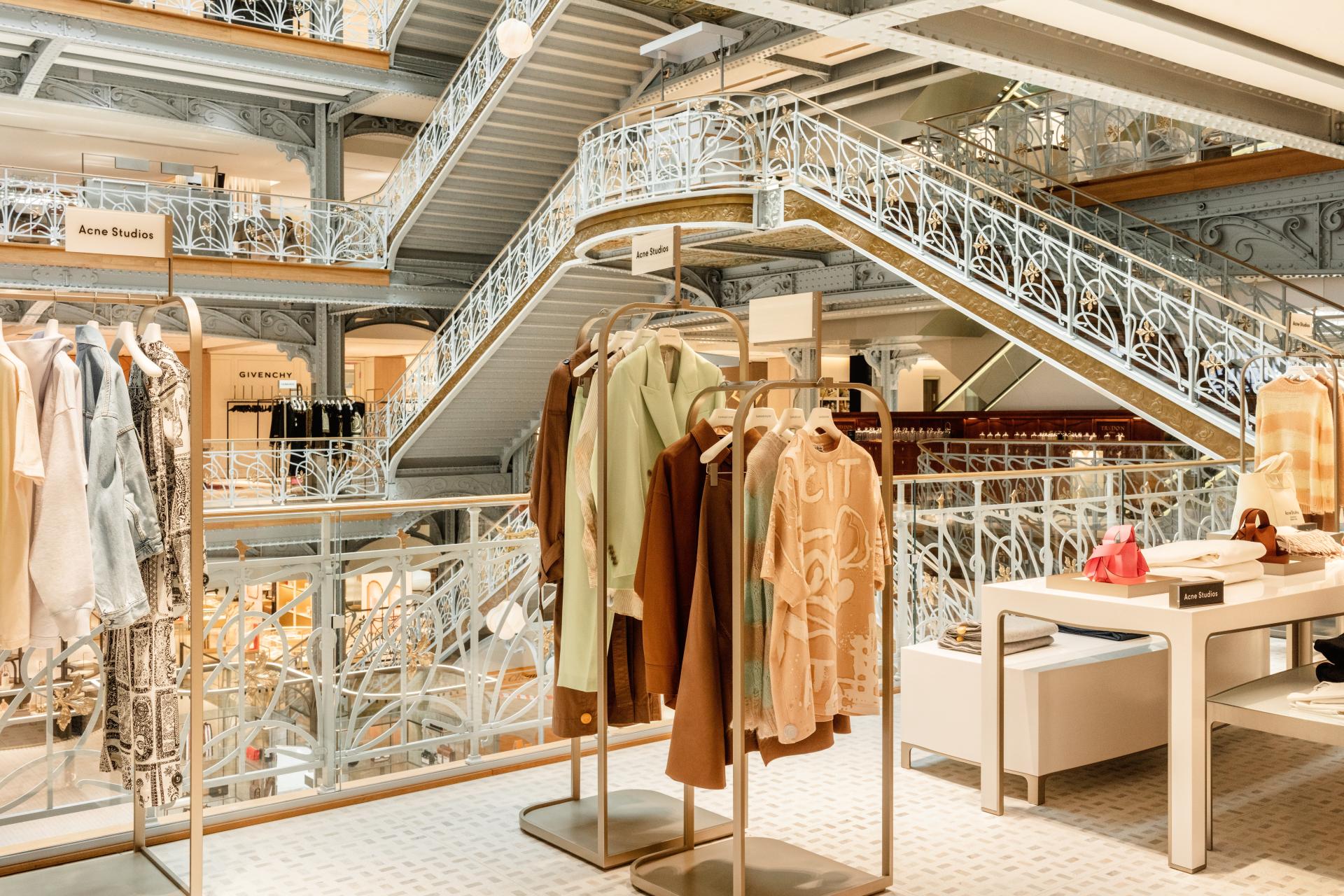 Modern retail space design showcasing elegant clothing displays and intricate architectural details by Yabu Pushelberg.