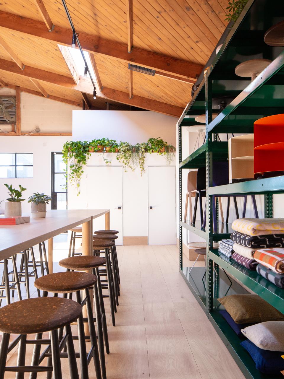 Bright and airy Hem showroom in Los Angeles showcasing modern furniture, greenery, and a stylish display area.