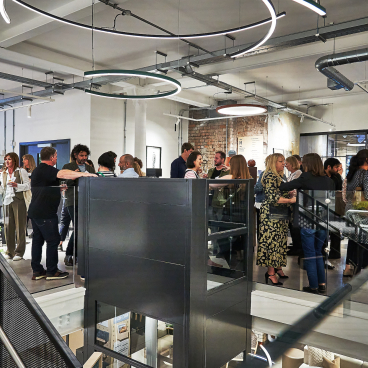 Guests mingling at the 42 Gathering event, celebrating the podcast "42 Roles in the Built Environment."