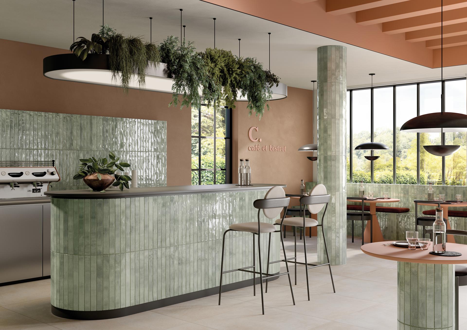 Contemporary café interior featuring Grestec's Mastreta elongated tiles, stylish furnishings, and vibrant plant decor.