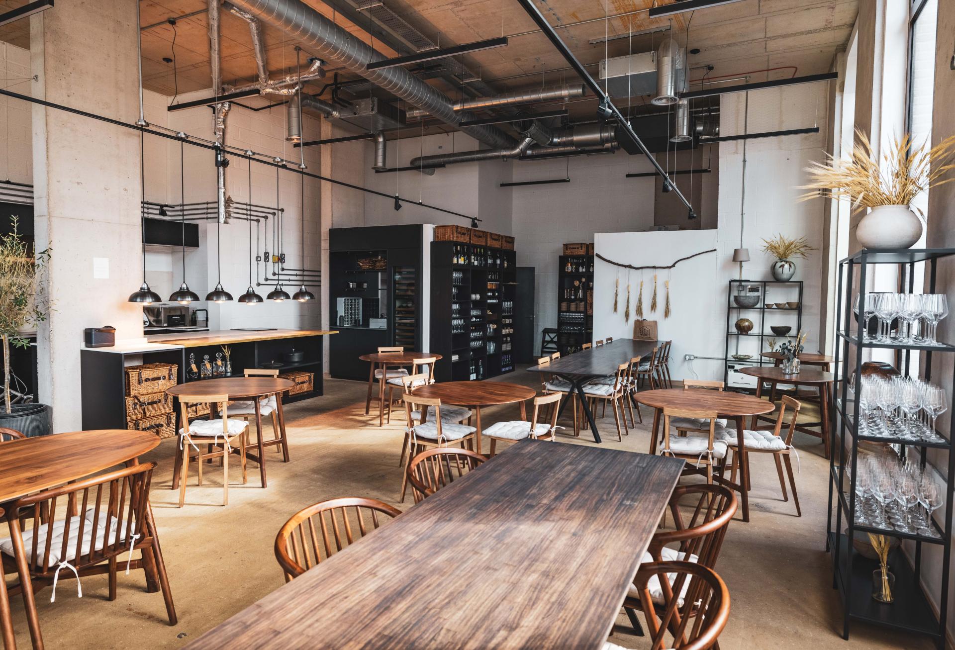 Stylish interior of The Water House Project restaurant in East London, showcasing Dekton® surfaces and modern furnishings.