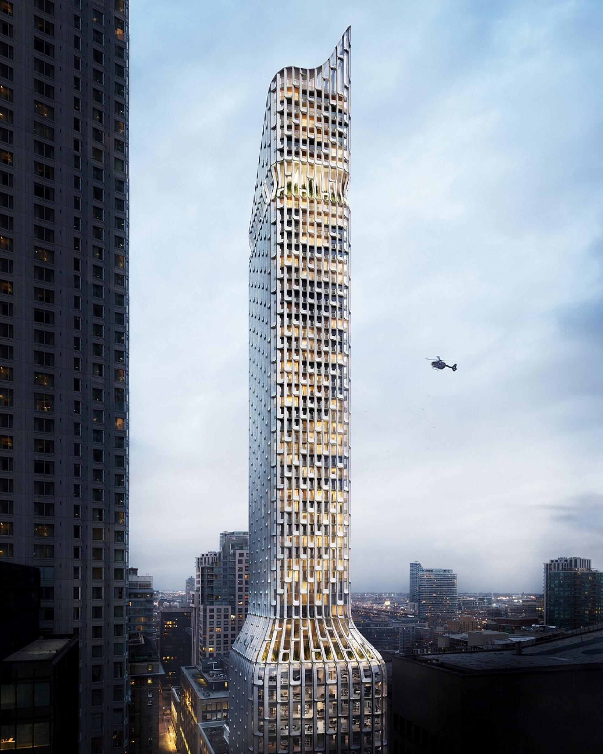 Modern architectural design of BDP Quadrangle’s 55 Yonge Street building illuminating Toronto's skyline at dusk.