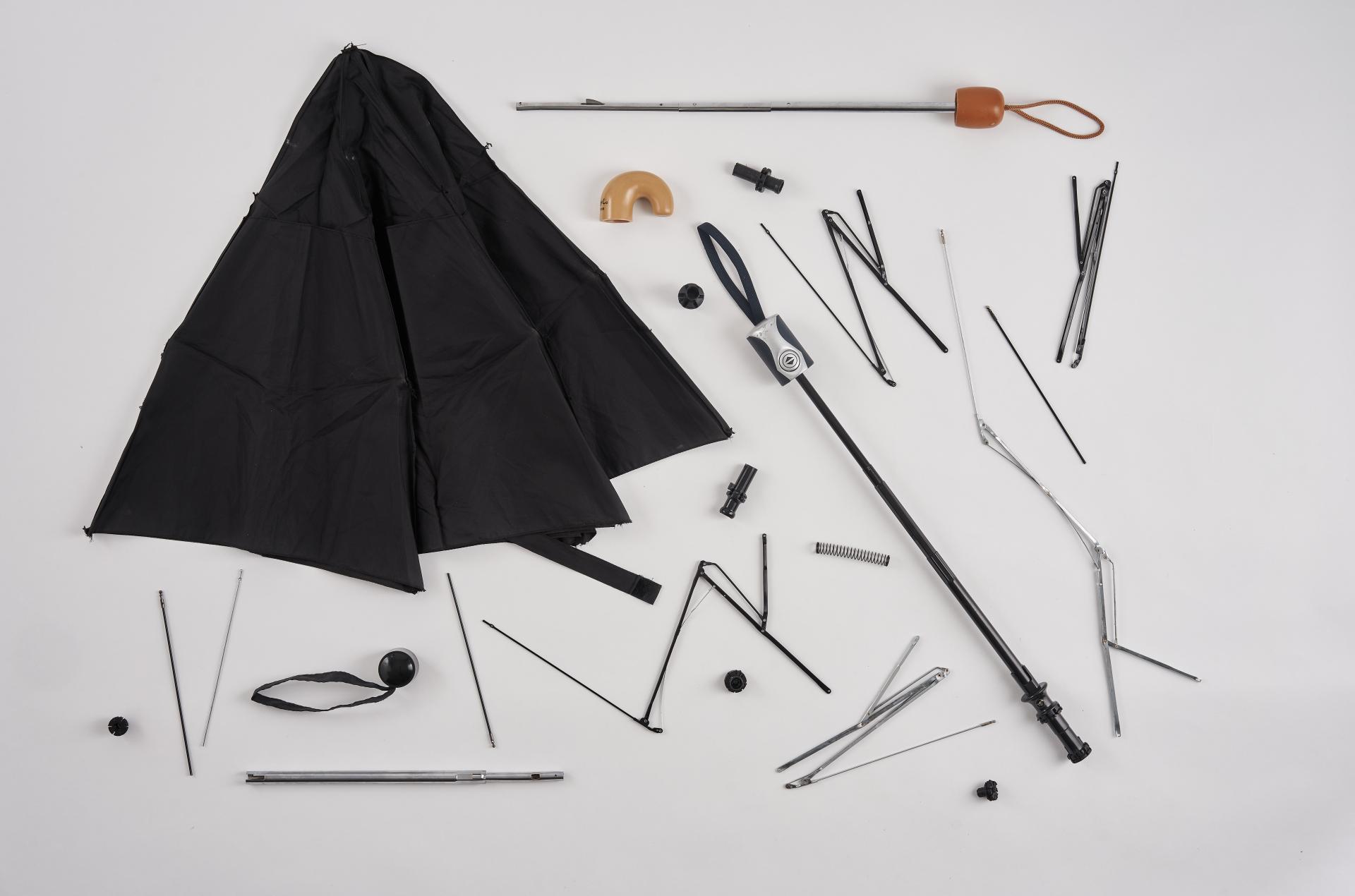 Upcycled lamp components made from discarded black umbrellas, demonstrating innovative repurposing for sustainable design.