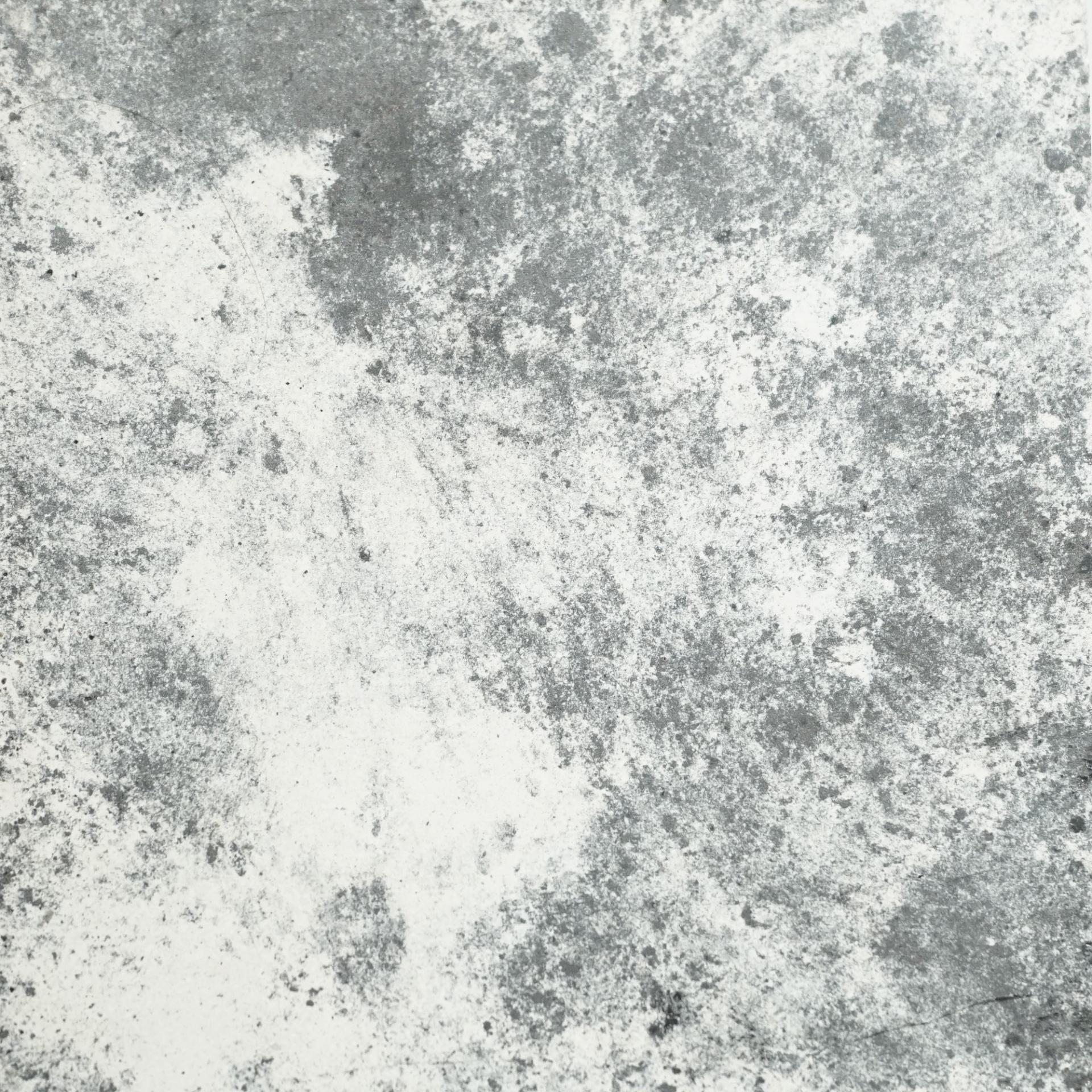 Sustainable bio-based tile design featuring a textured grey and white surface, showcasing DeakinBio's innovative materials.