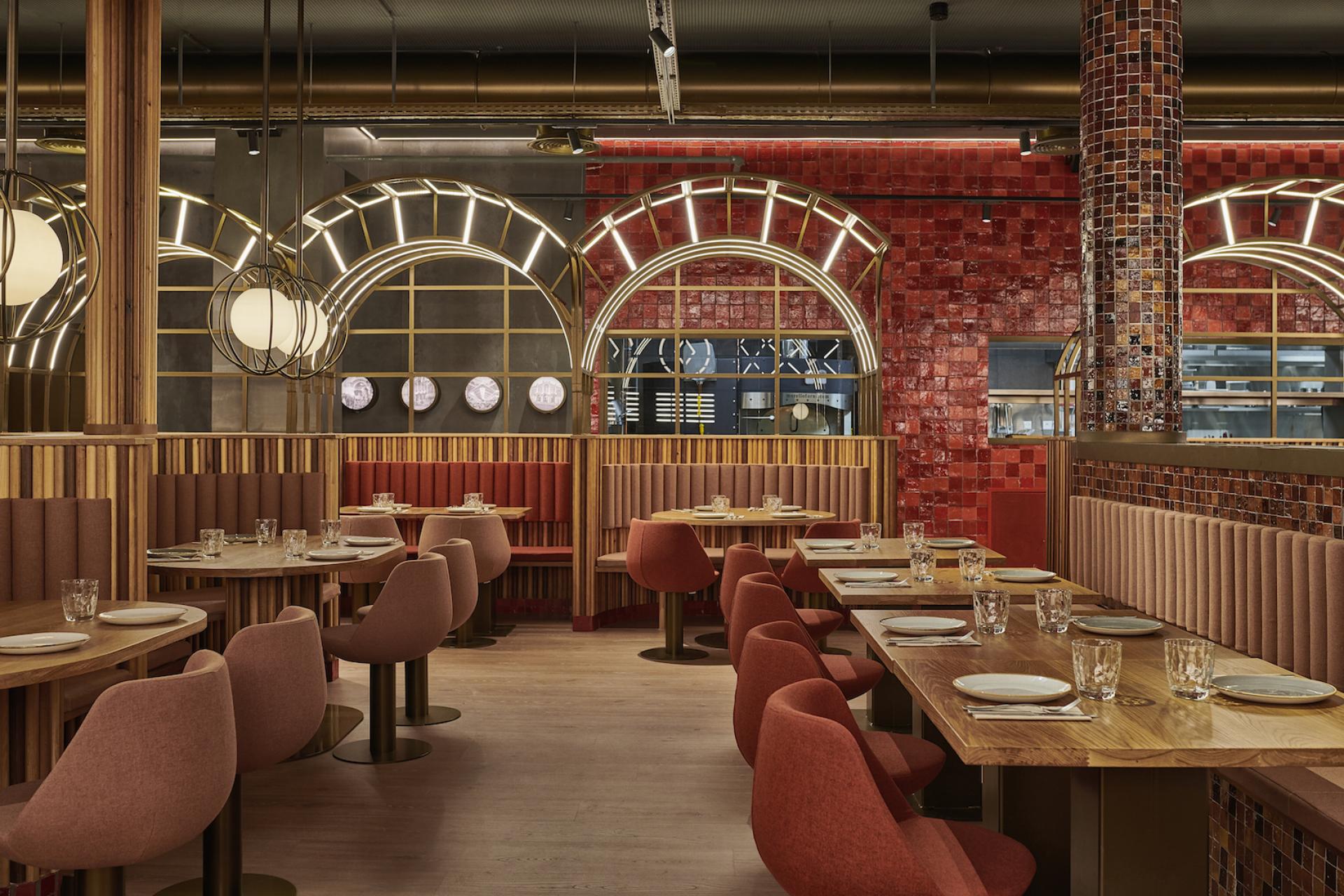 Modern interior design of Piur restaurant, featuring stylish seating, unique lighting, and vibrant red tiled walls.
