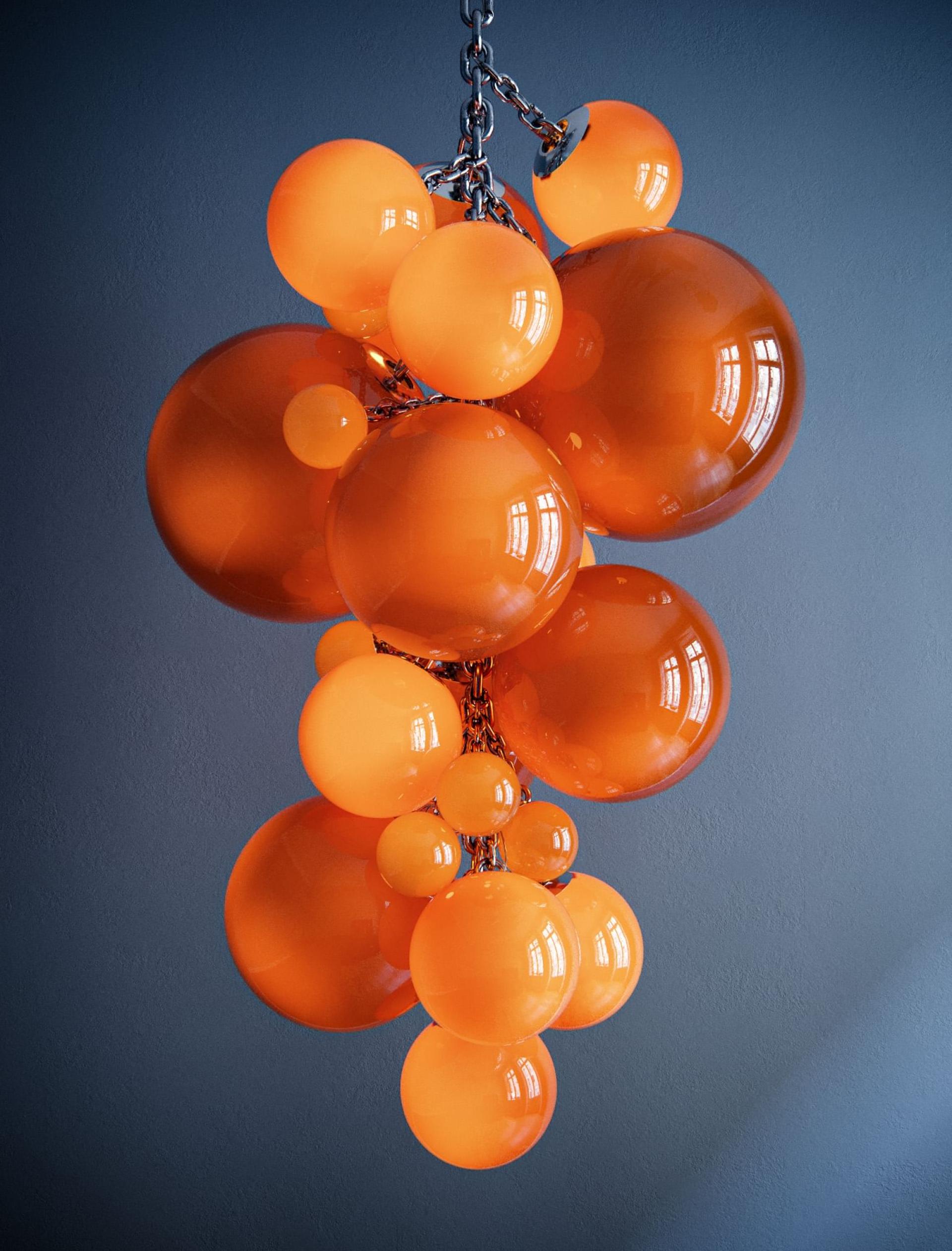 Stylish Kuulas chandelier by Cameron Design House featuring vibrant orange glass orbs suspended from a sleek chain.