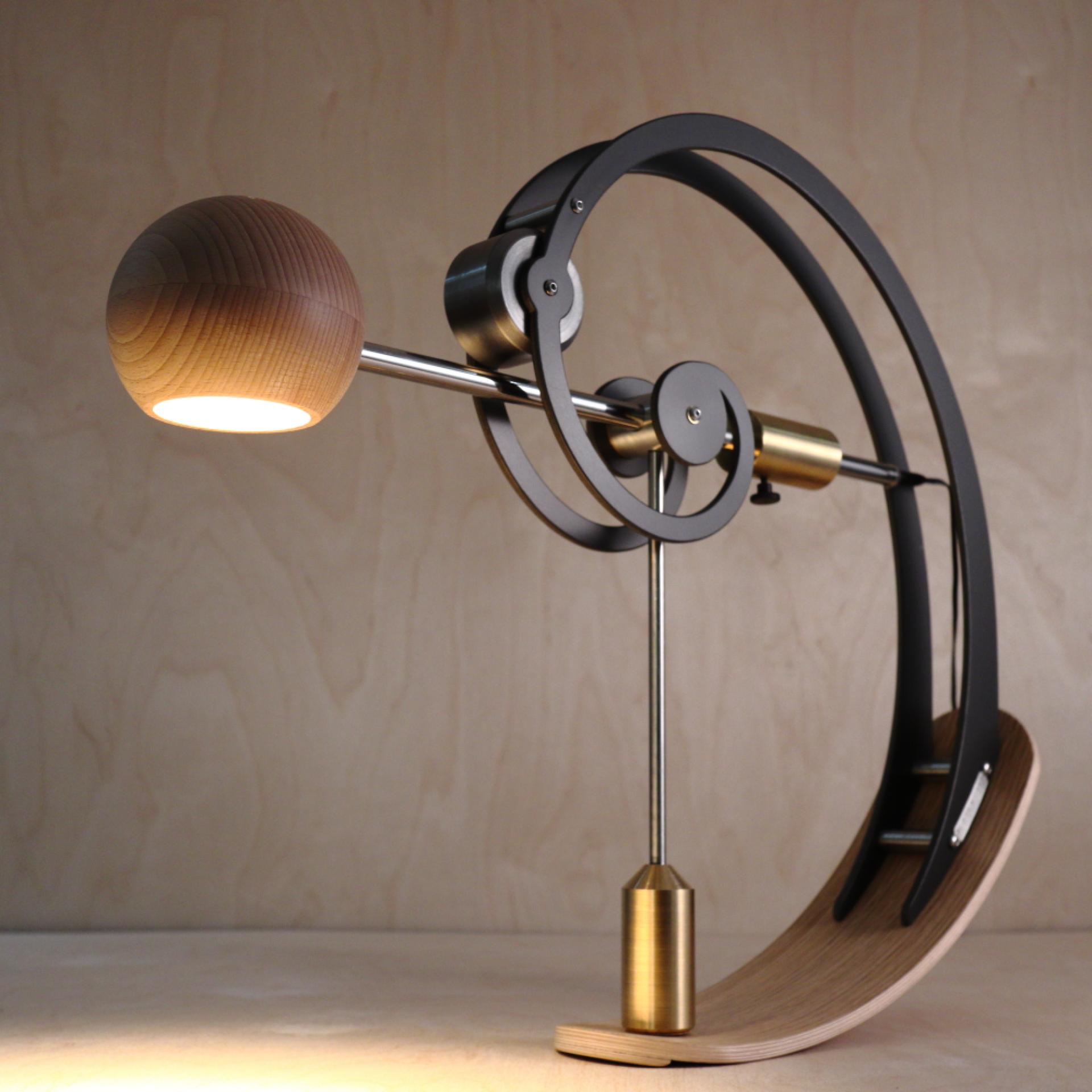 Contemporary crafted lamp with wooden and metal elements, featured at The Great Northern Contemporary Craft Fair in Manchester.