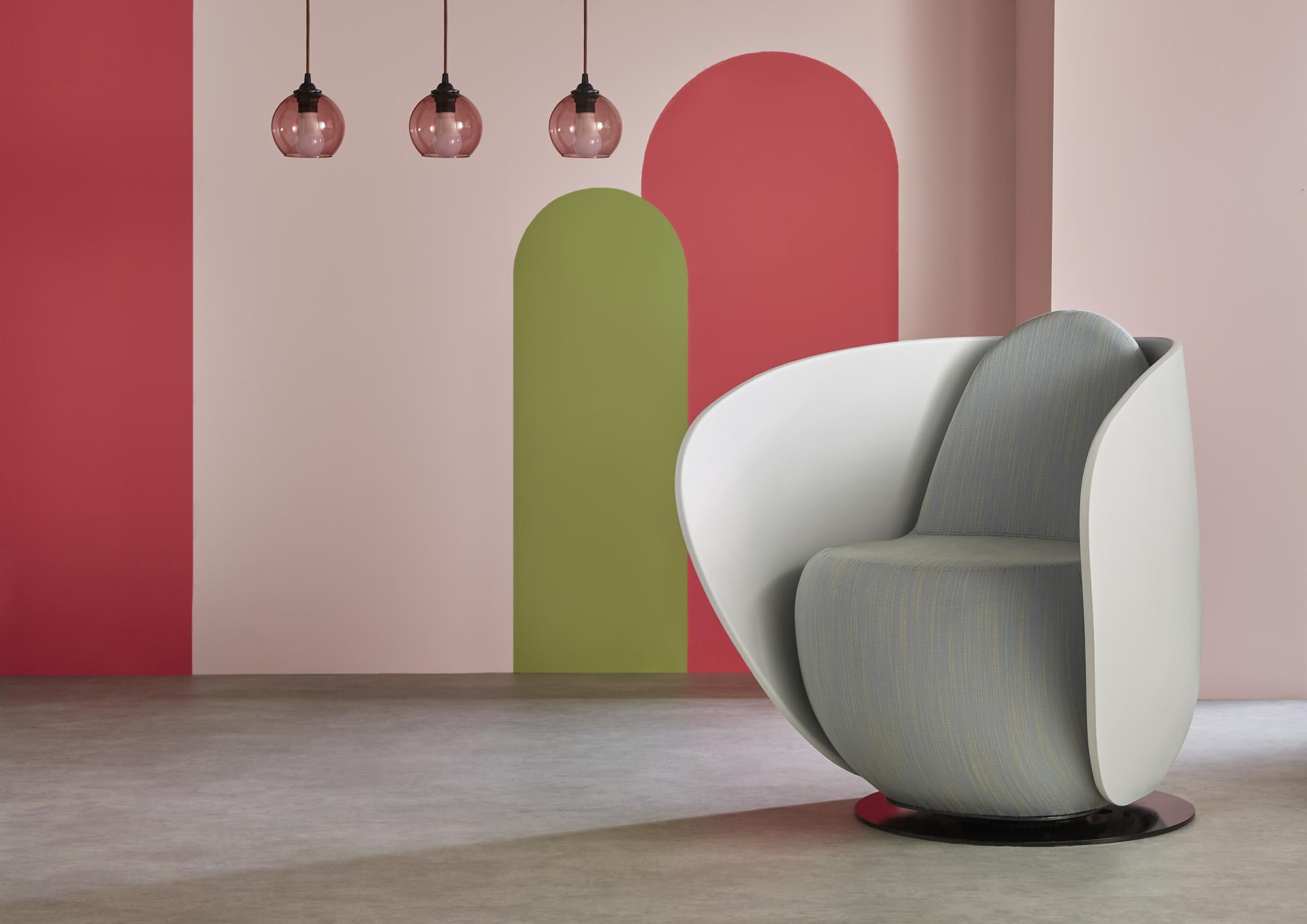 Rounded cocoon chair from Gresham’s Relo collection against colorful, calming walls, enhancing workspace comfort and aesthetics.