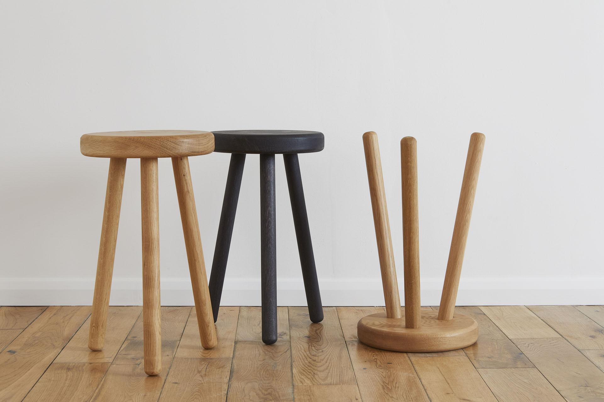 Stylish wooden stools in natural and dark finishes, showcasing Glasgow's contemporary craft and design aesthetic.