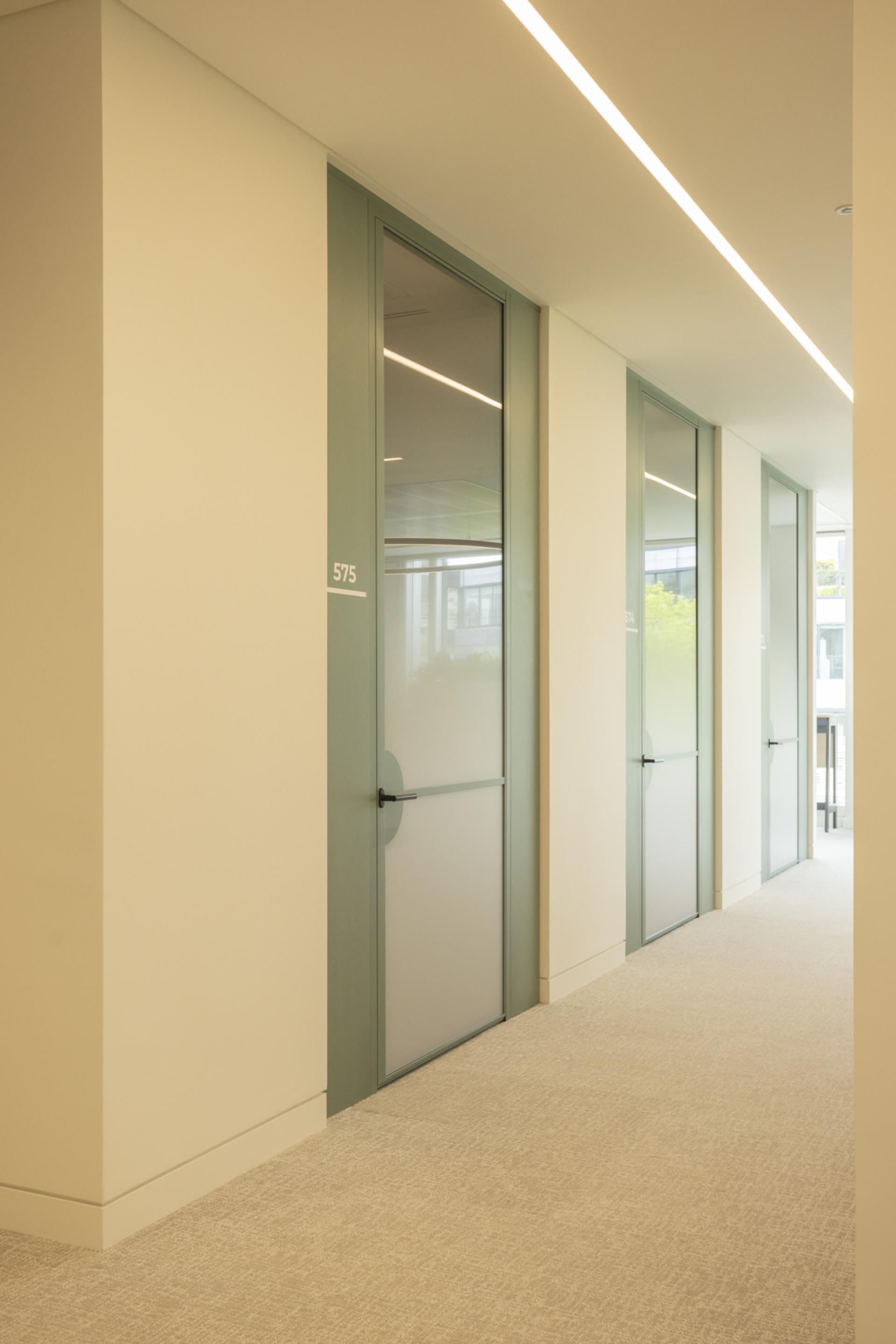 Bespoke door designs and high-end office partitions by Radii for Goodwin Procter.