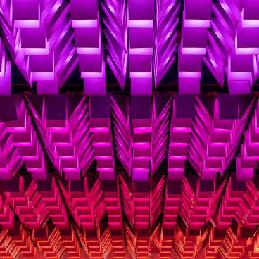 Colorful architectural design featuring geometric lighting patterns at New Century, a unique community venue transformation.