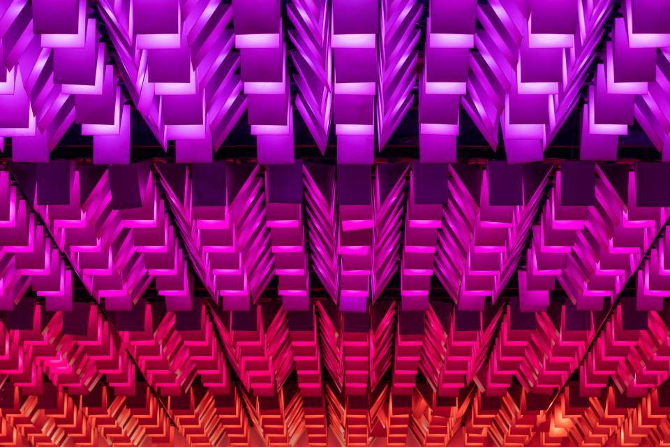 Colorful architectural design featuring geometric lighting patterns at New Century, a unique community venue transformation.