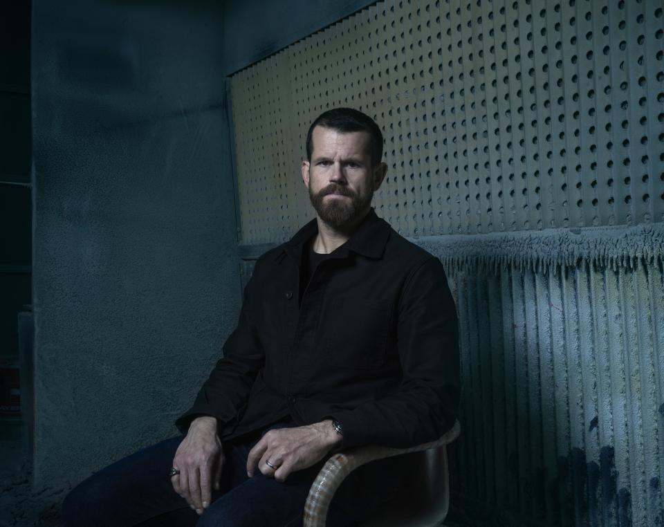 Matthew Day Jackson poses in a modern setting, showcasing the creative collaboration with Made by Choice and Formica Group.