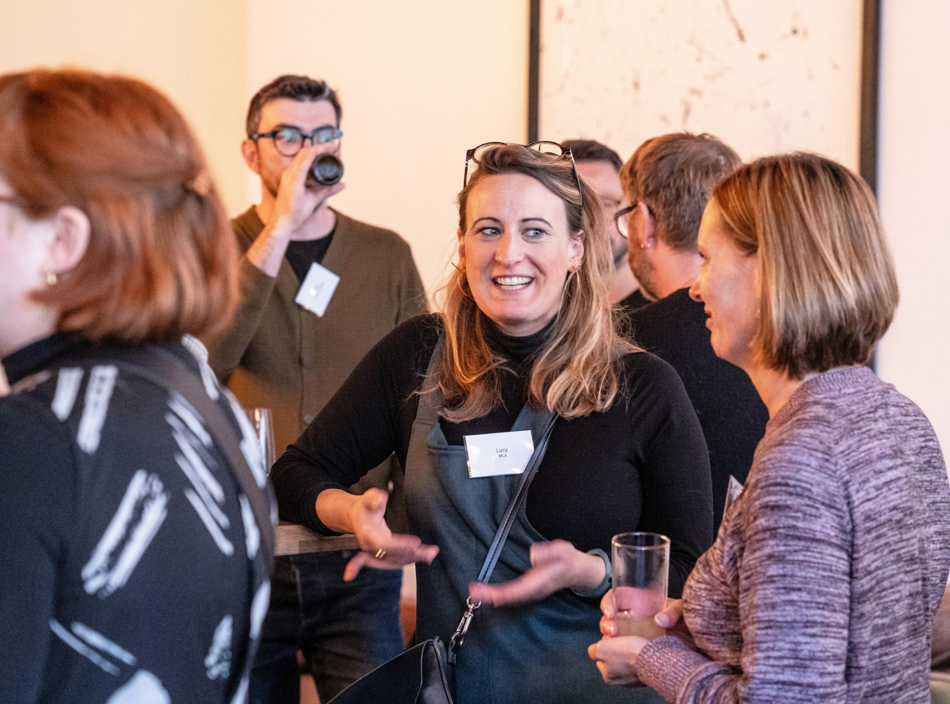 Networking event at Glasgow Property Outlook seminar, featuring engaged attendees discussing the future of real estate in Glasgow.