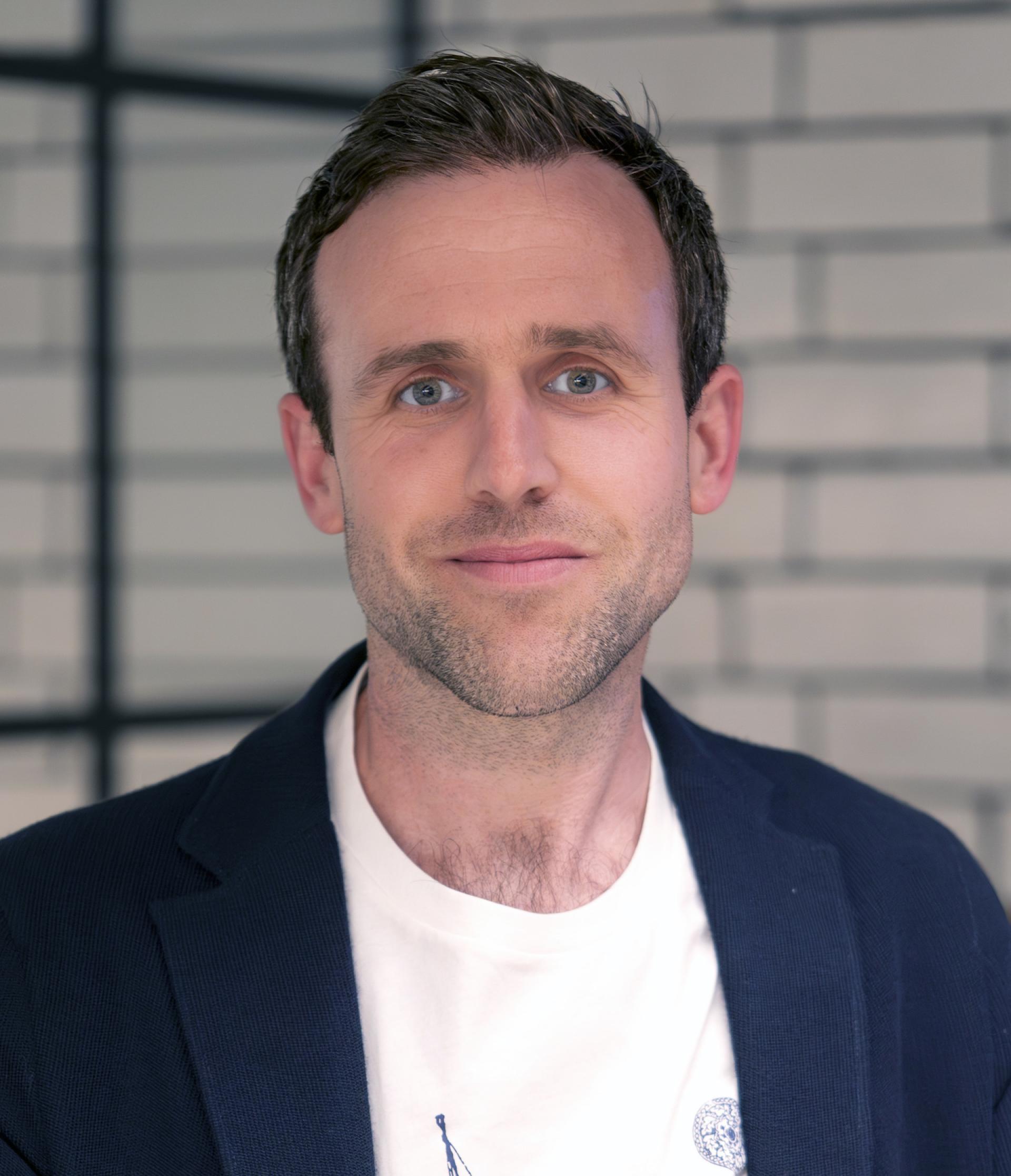 Professional speaker at Manchester Property Outlook seminar, discussing residential mix and urban development challenges.