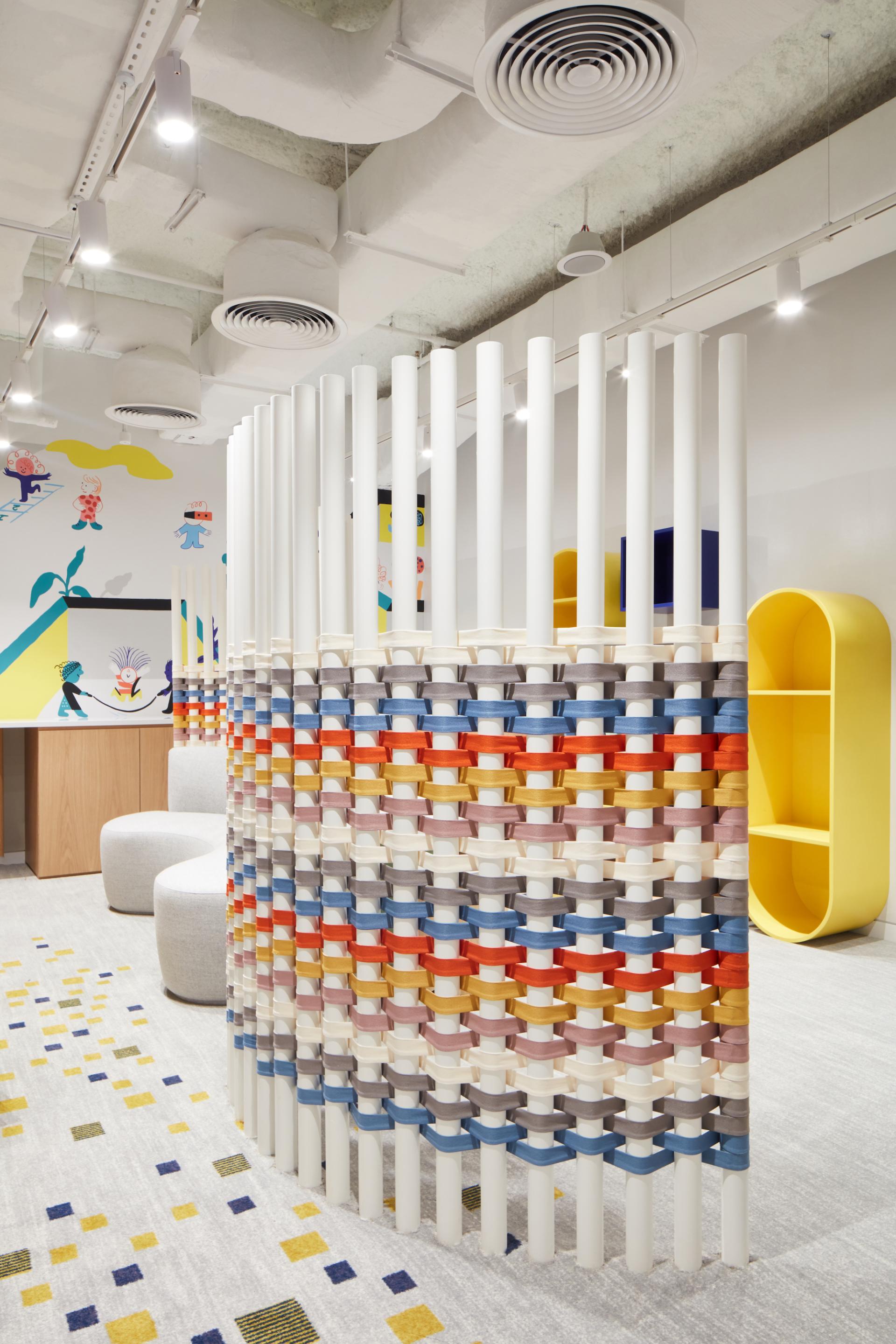 Colorful interior design featuring playful divisions and furnishings in the Early Childhood Authority headquarters by Roar Studio in Dubai.