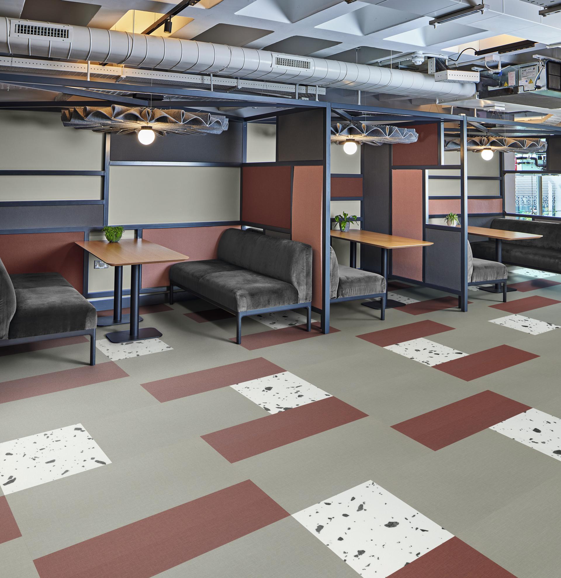 Modern workspace featuring Karndean's Opus abstract flooring collection, showcasing innovative design and contemporary seating areas.