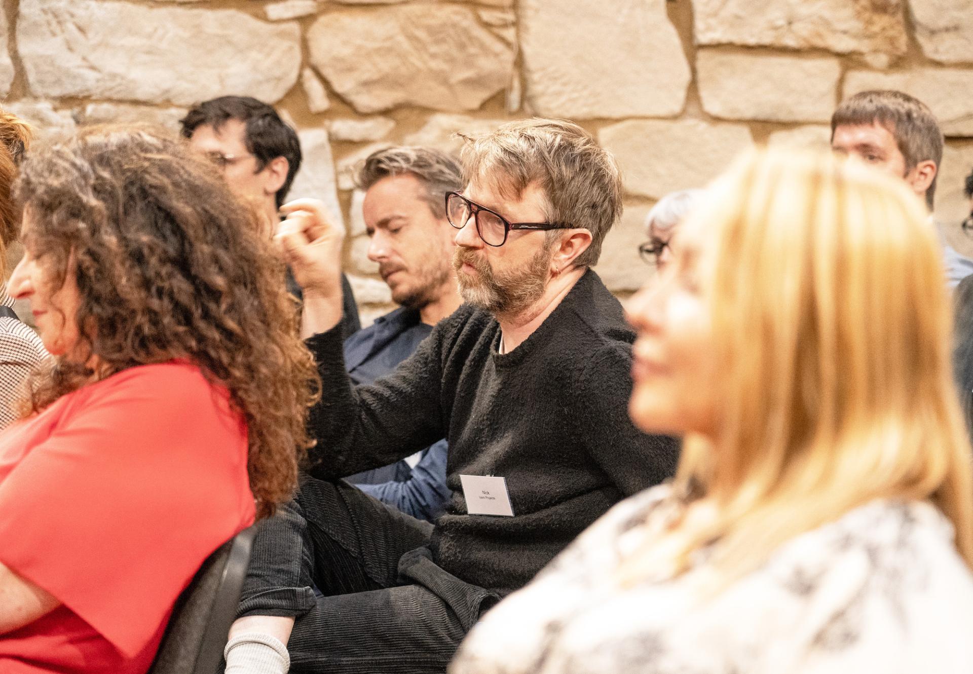 Audience members engaged in discussion at the Material Source Studio seminar on Glasgow property trends.