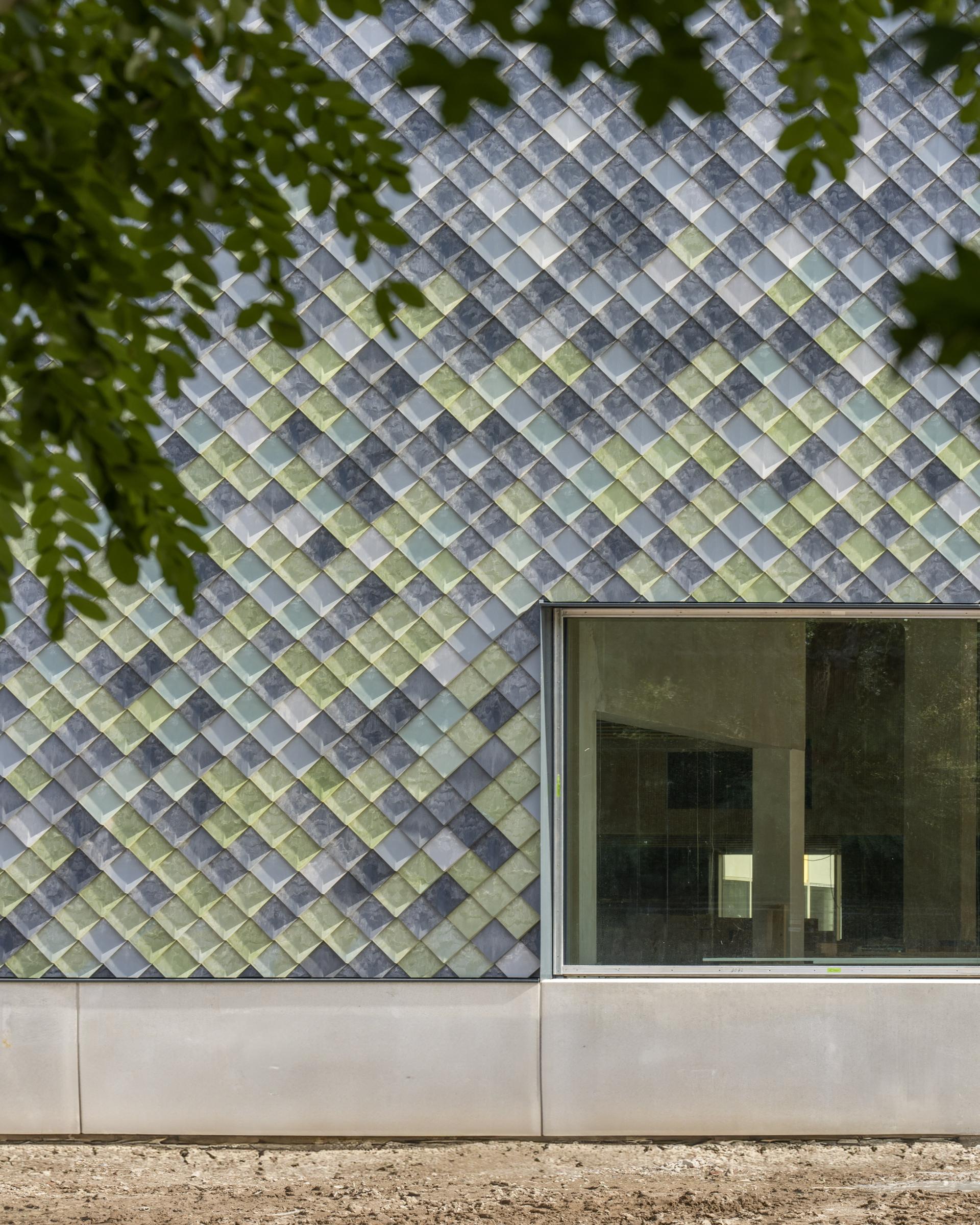 Modern building facade showcasing innovative plastic cladding, part of Pretty Plastic's circular construction project at Tongelreep National.