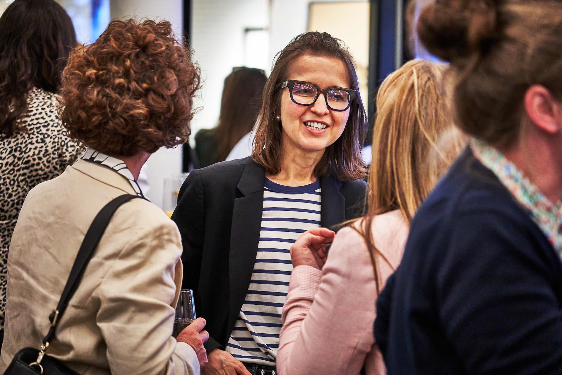 Women networking and celebrating at the 42 Gathering event for the podcast 42 Roles in the Built Environment.