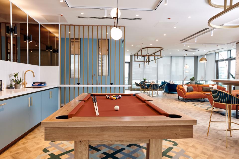 Modern communal lounge in The Headline, featuring a stylish pool table and contemporary seating for residents.