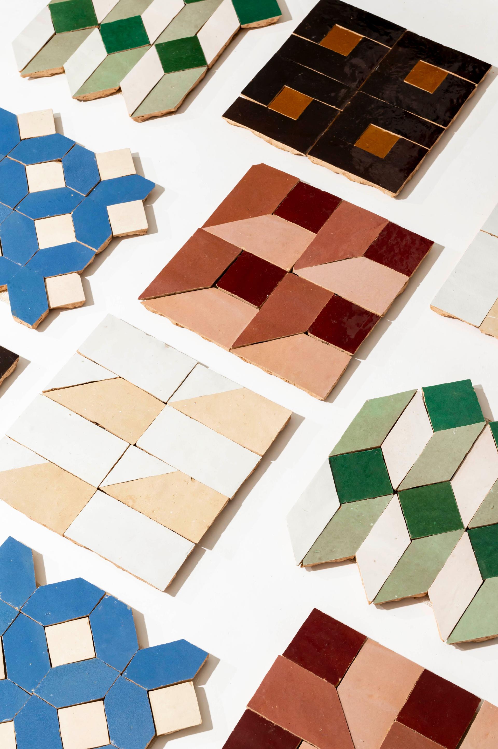 Vibrant zellige mosaic tiles in geometric patterns showcase a variety of colors and designs by Zia Tile.