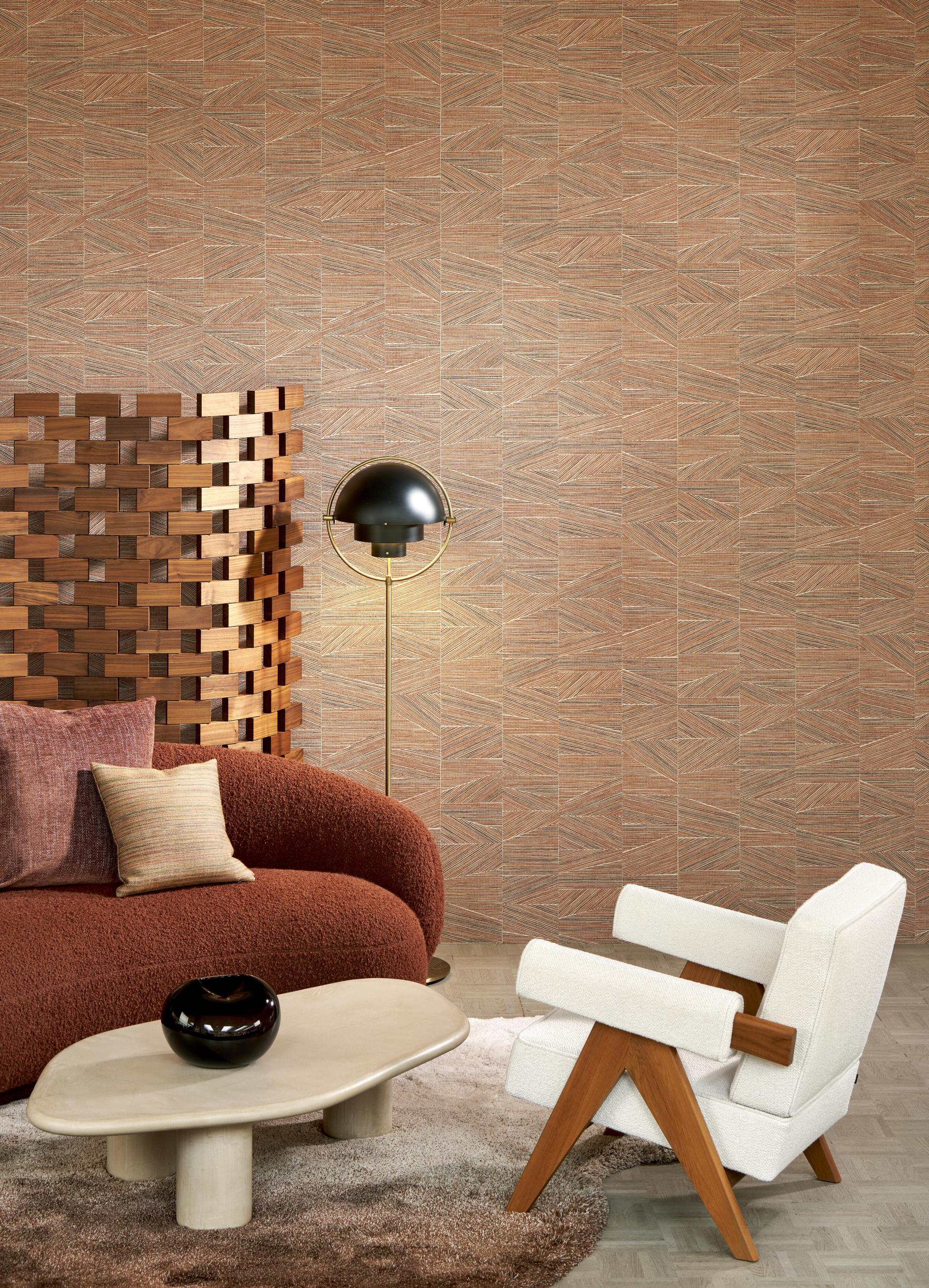 Modern interior featuring Arte's geometric totem wallcovering, a stylish brown couch, and contemporary furniture pieces.
