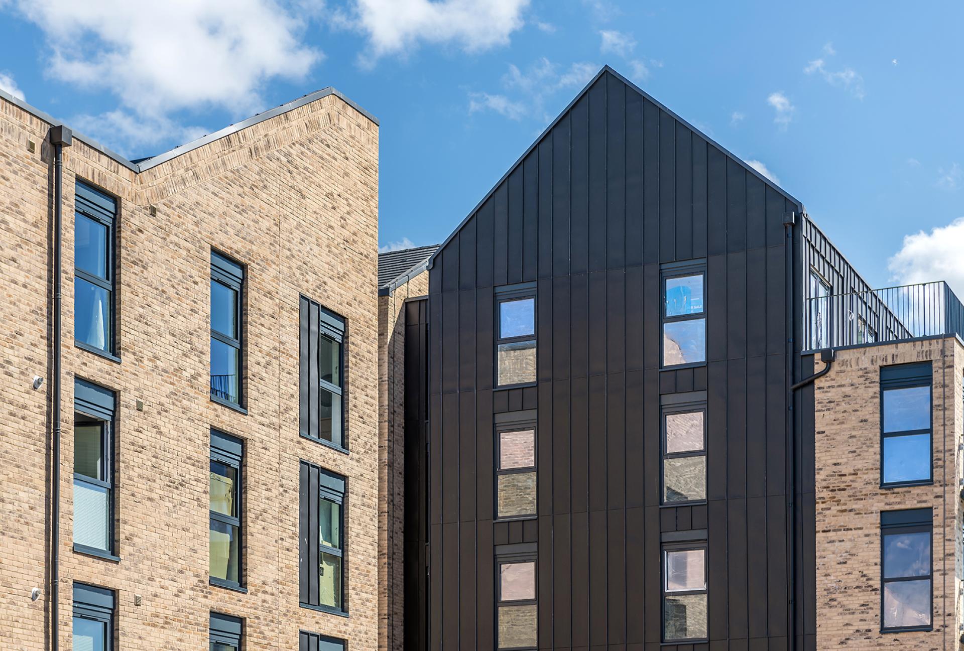 Modern multi-story residential buildings highlighting innovative architecture, reflecting Michael McGurk's insights on Scotland's BTR housing needs.